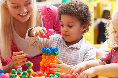 Child playing with toy in school